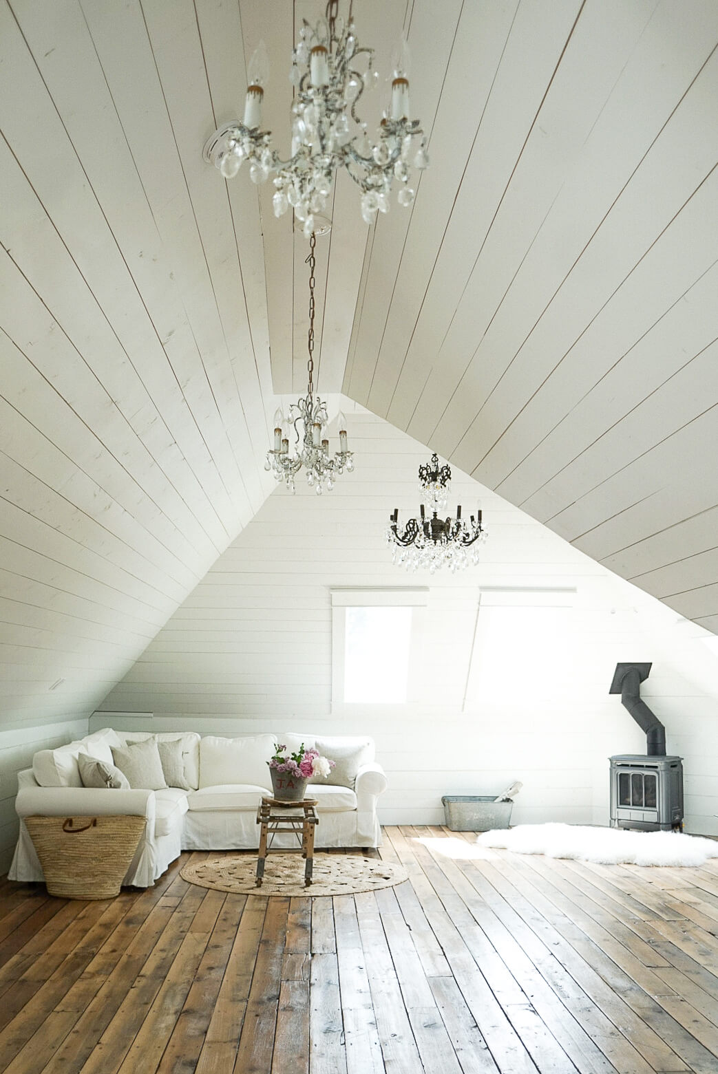 farmhouse chandeliers in shiplapped attic family room