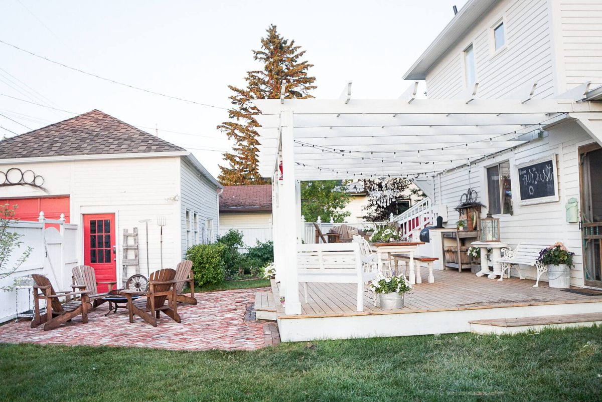 side view salvaged brick patio and pergola deck