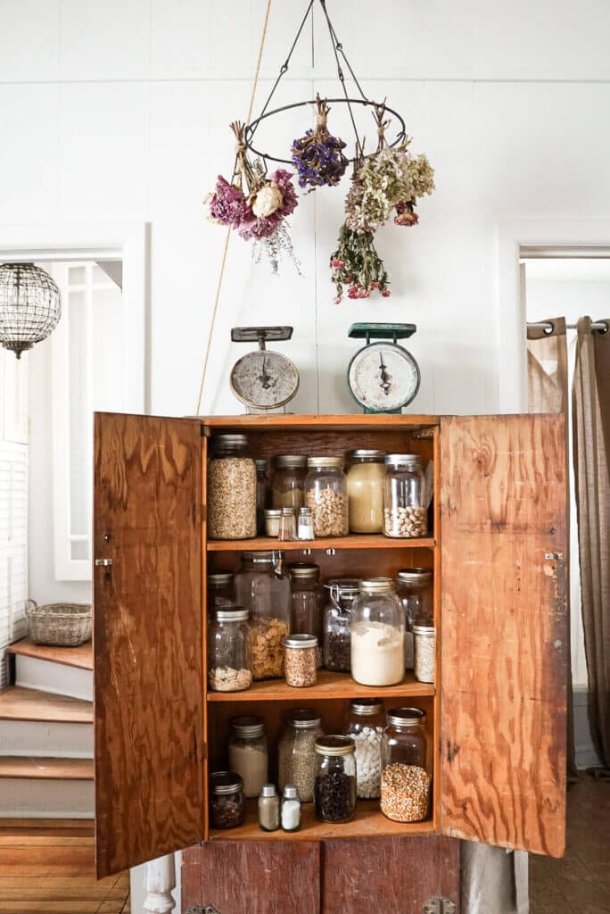 cabinet full of jars in the kitchen