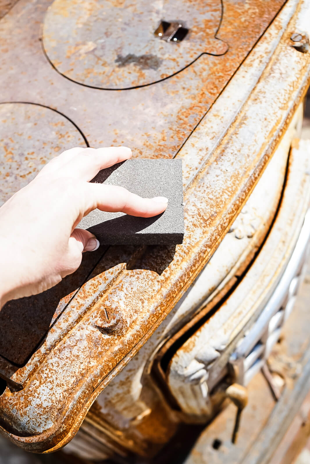 sanding the outdoor wood burning fireplace