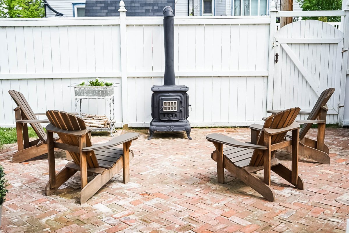 sitting area for an outdoor wood burning fireplace