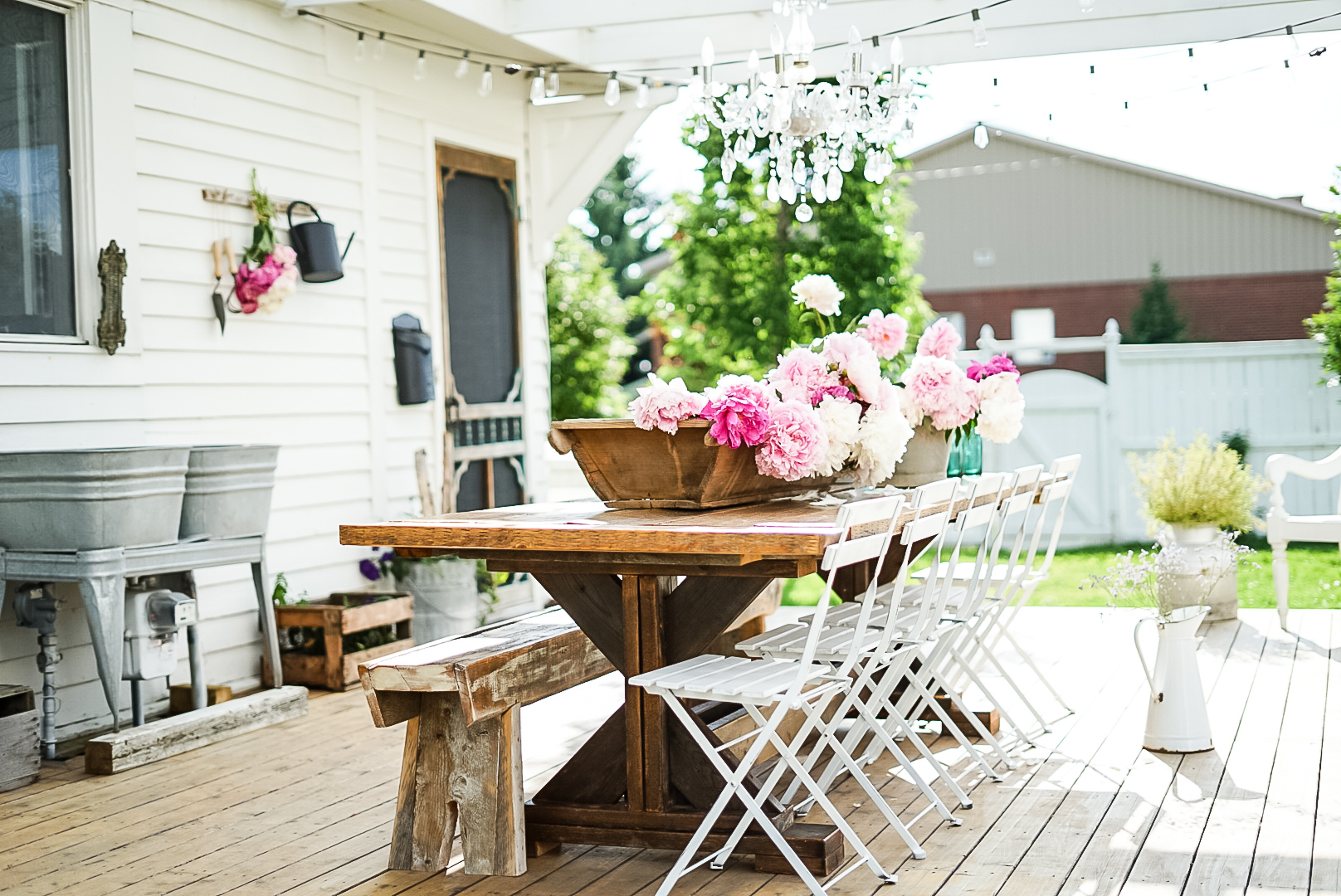 french antiques on an outdoor farmhouse patio Peonies on farmhouse outdoor patio table