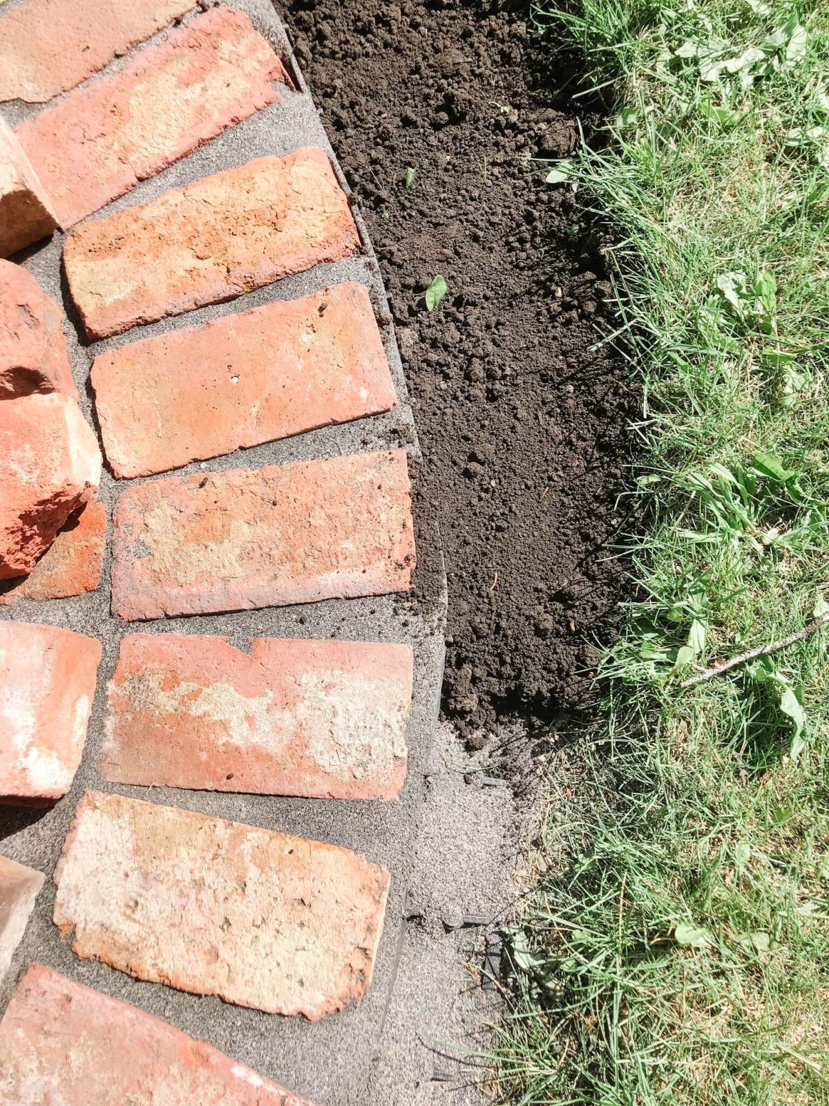 Back-Filling Place Dirt and Grass Seed around edge of Fire Pit