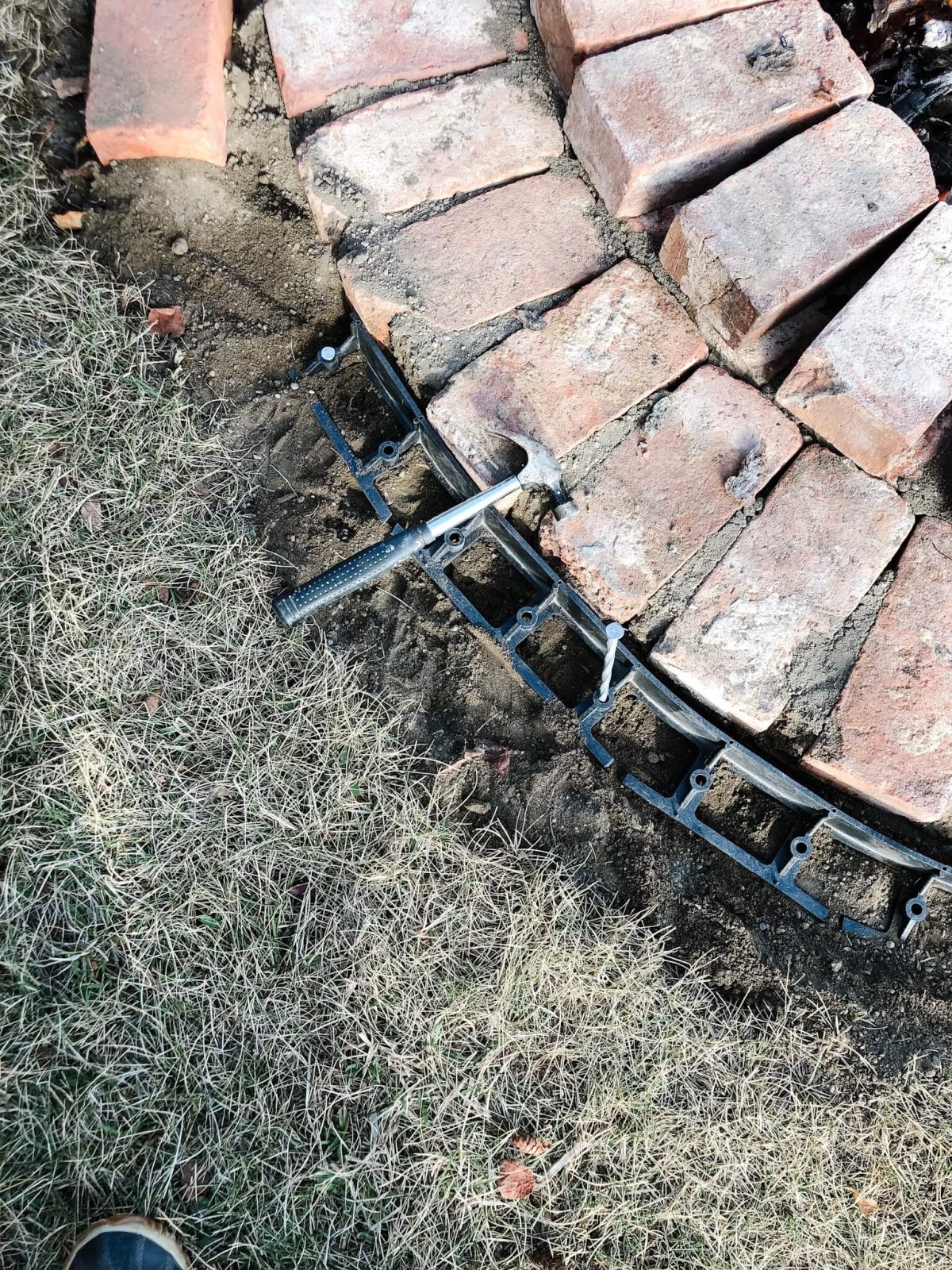 Fire-Pit-Edging Put plastic trim around the bricks to hold them in place