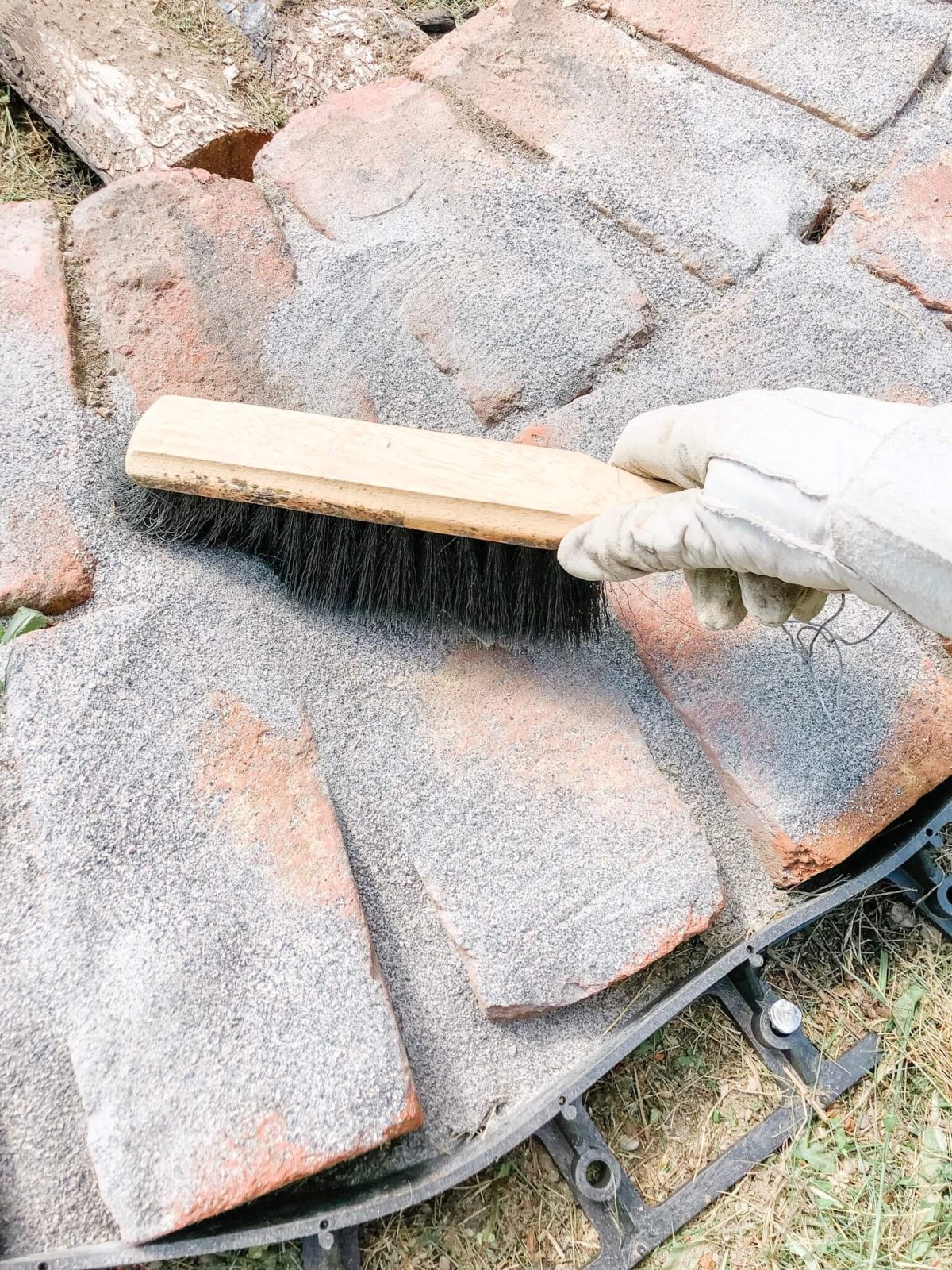 Sweep-sand sweep the polymeric sand into the little cracks