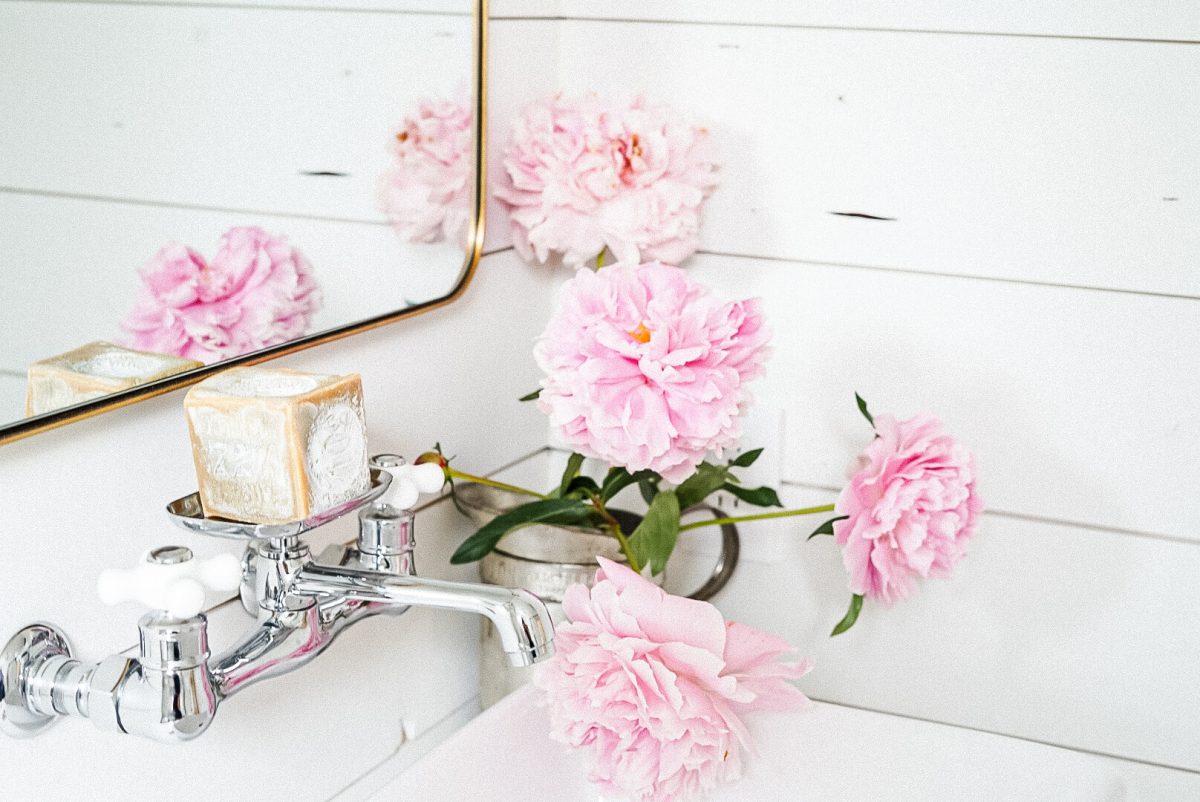 block soap in a bathroom Fresh flowers in a bathroom vanity