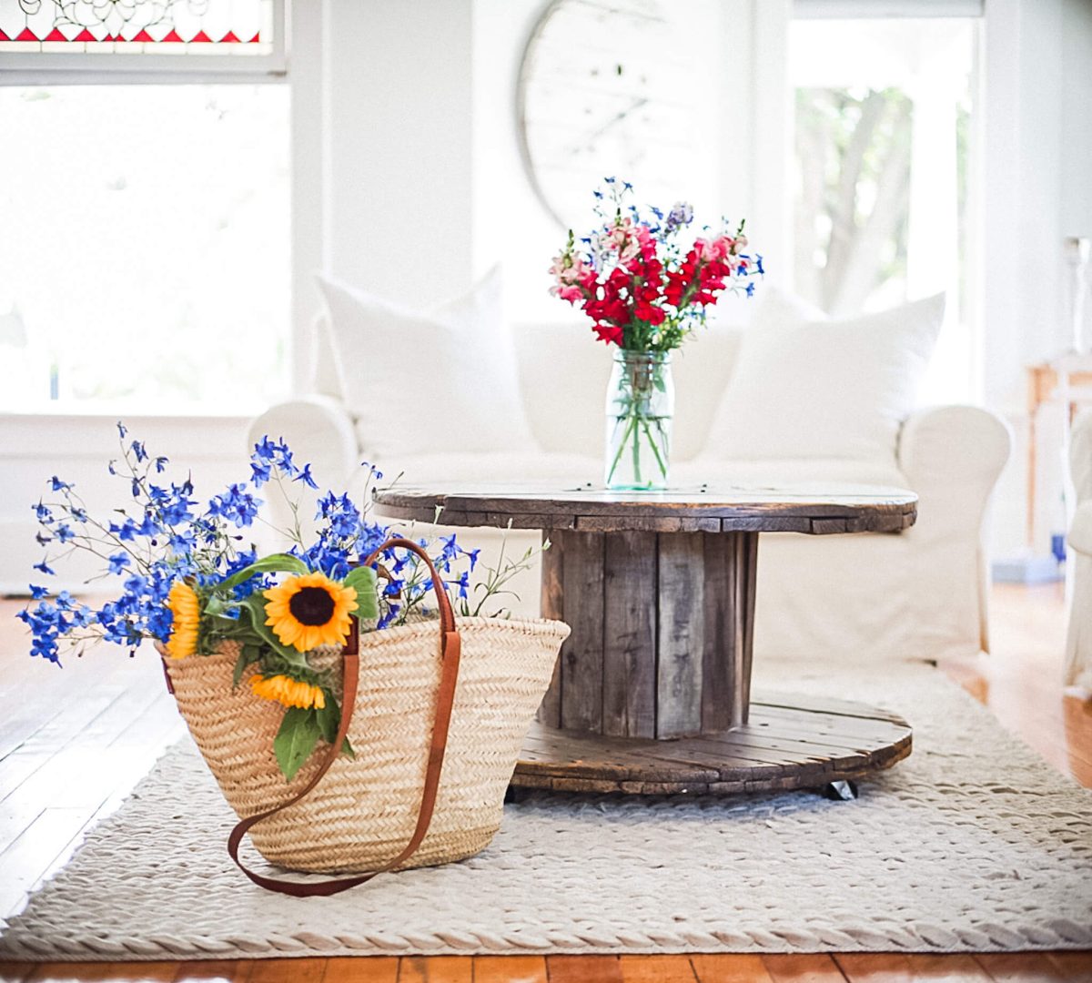 Spool farmhouse coffee table decor Spool farmhouse coffee table market basket full of fall flowers