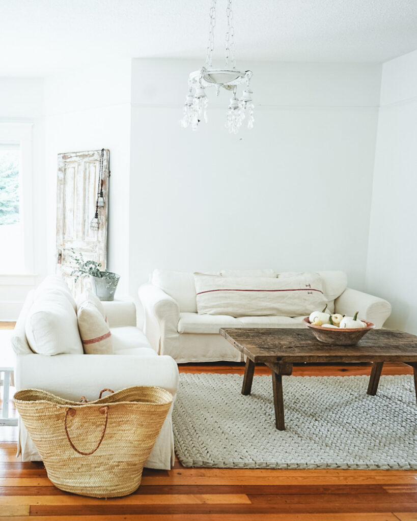 Rectangle Rustic Coffee Table in front of a sofa in a living room.