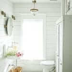 white shiplap barthroom with french antiques