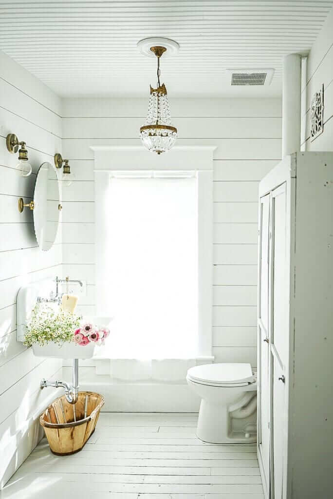 white shiplap barthroom with french antiques