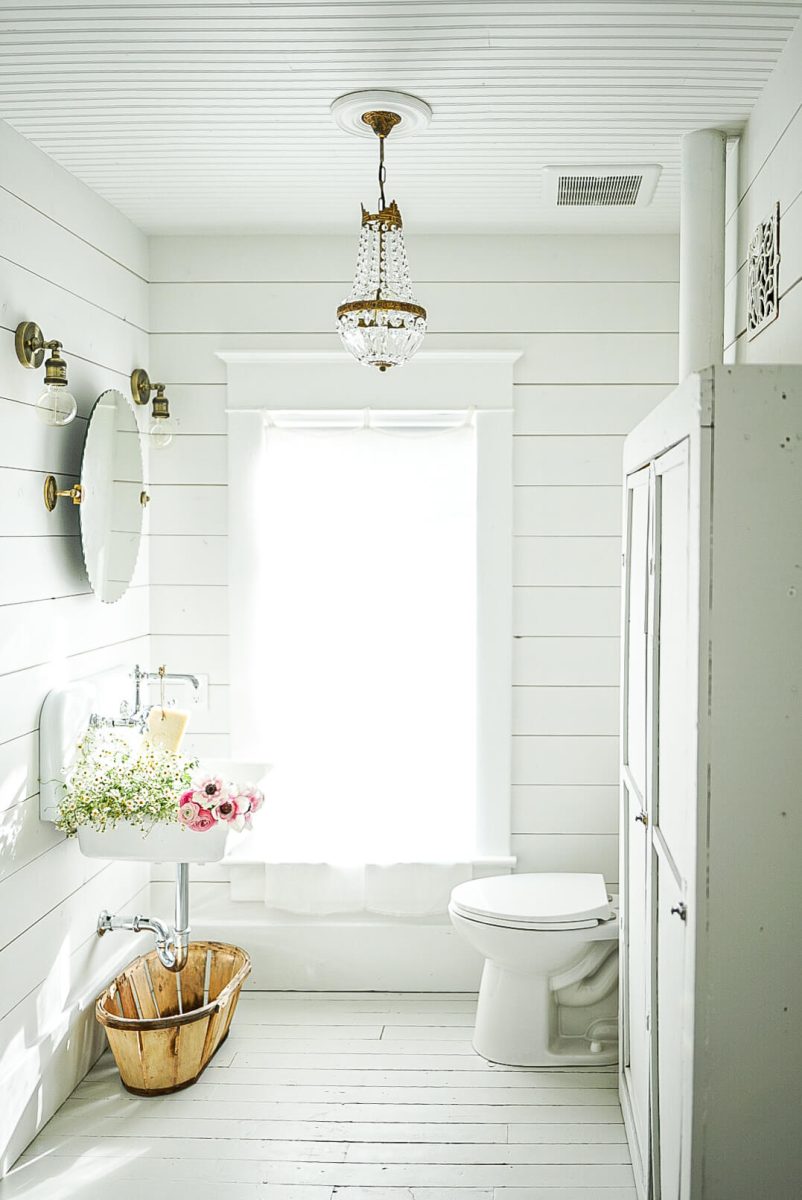 white shiplap barthroom with french antiques
