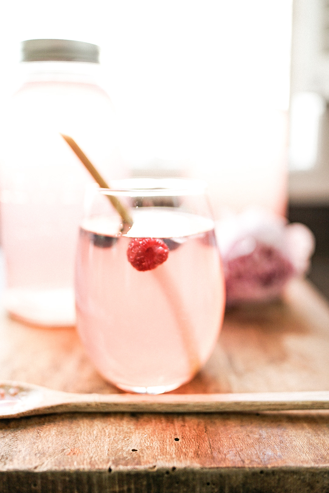 rhubarb syrup and soda in a wine glass