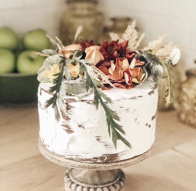 Fall decor on a rustic nearly naked cake