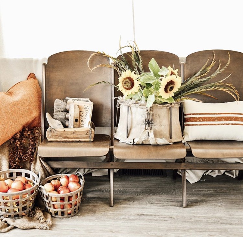 the curated farmhouse fall home decor home tour vintage folding bench apples in baskets sunflowers red ticking stripe