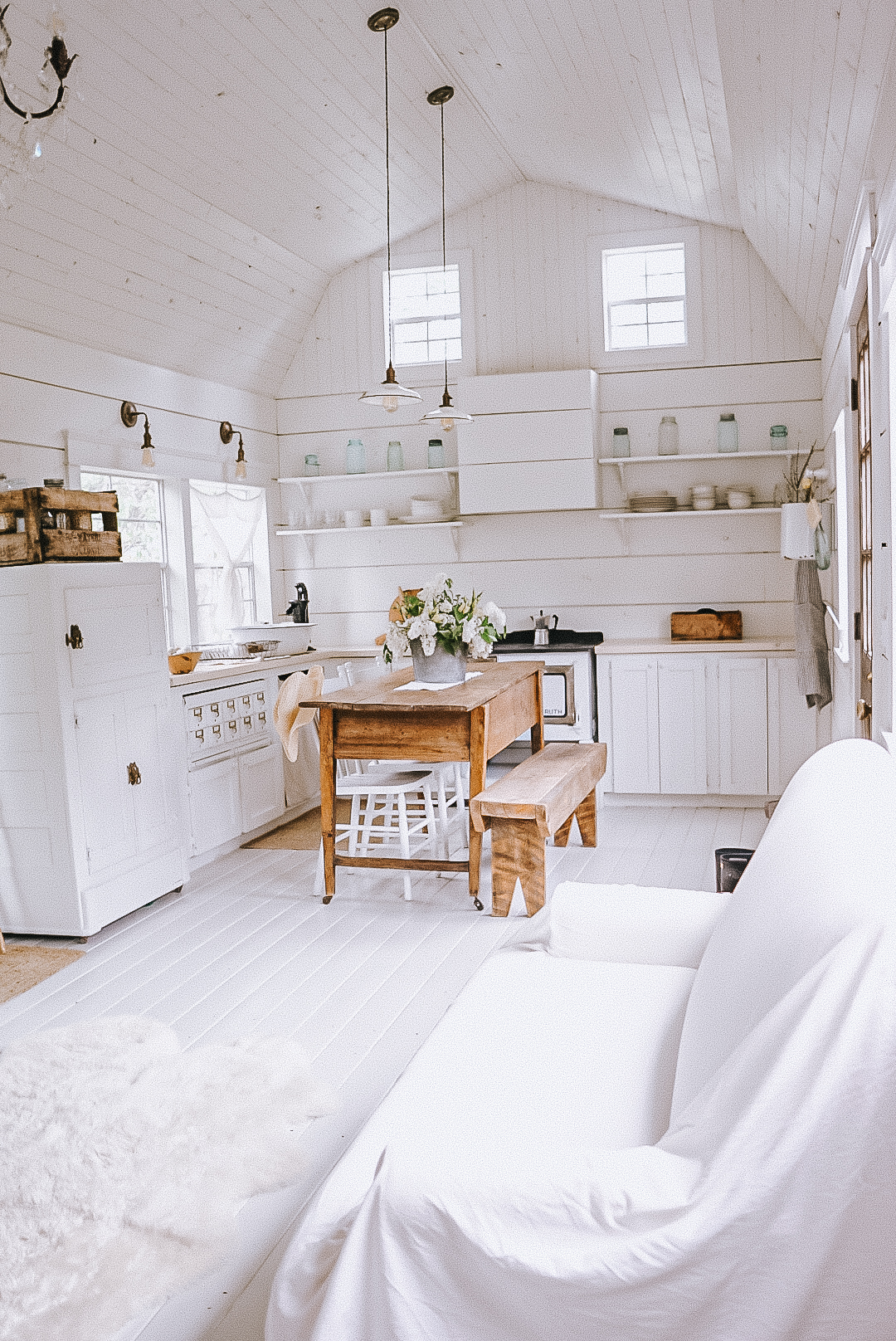kitchen in the tiny house shed cabin with an old fashion water pump