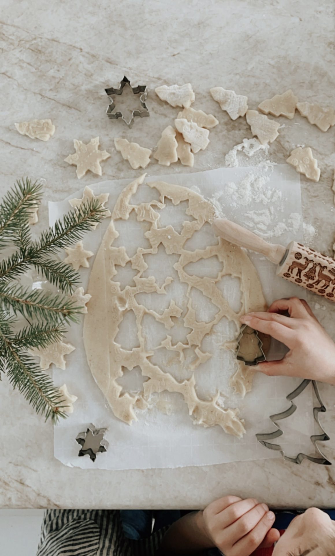 cookies being cut with a cookie cutter
