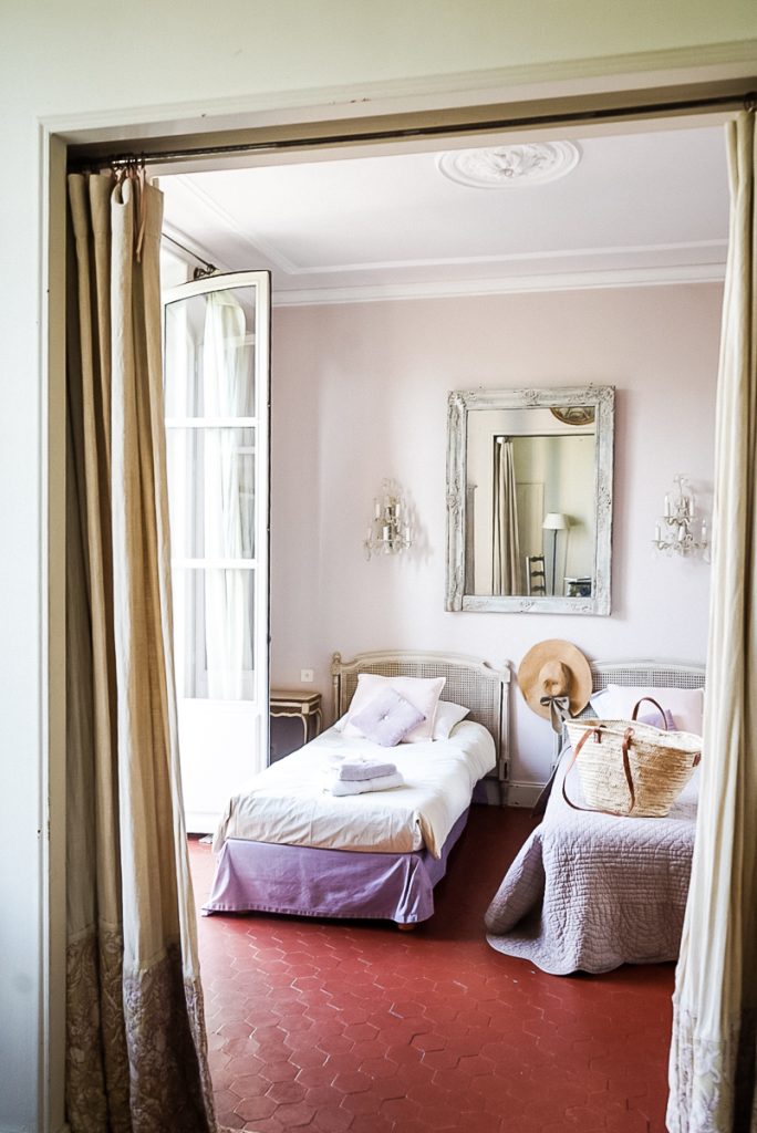 Bedroom with french doors open and natural light coming in to make a happier home