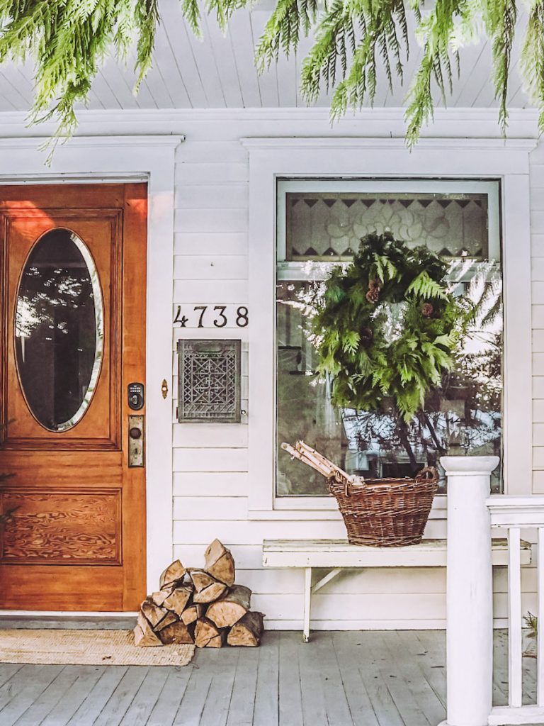 Simple front porch decor with an evergreen wreath