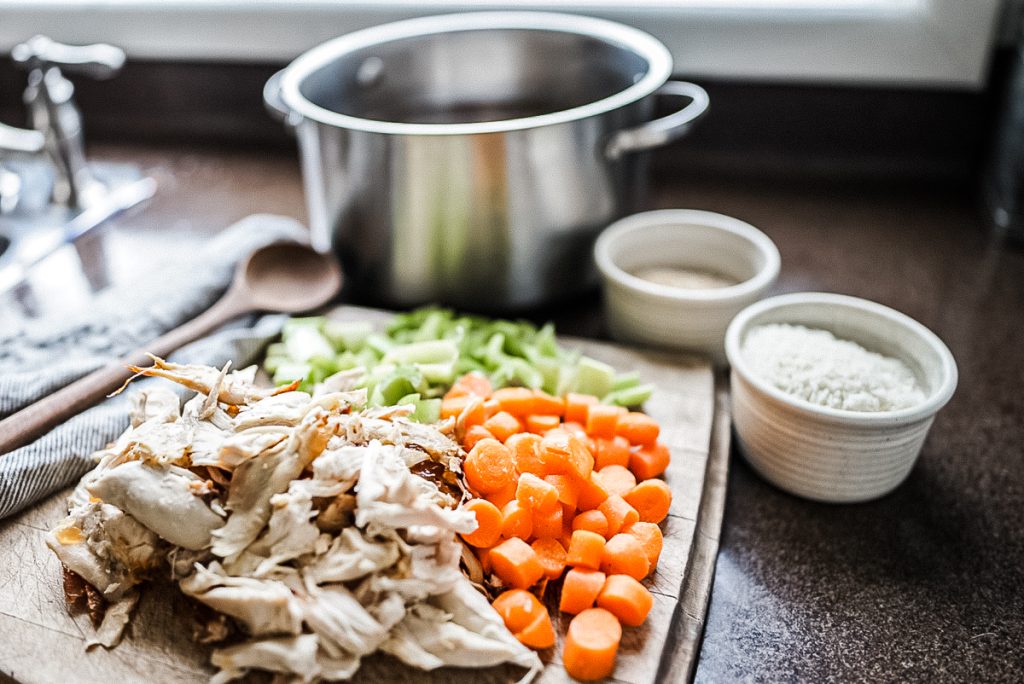 cut carrots, celery, barley and shredded chicken for making soup