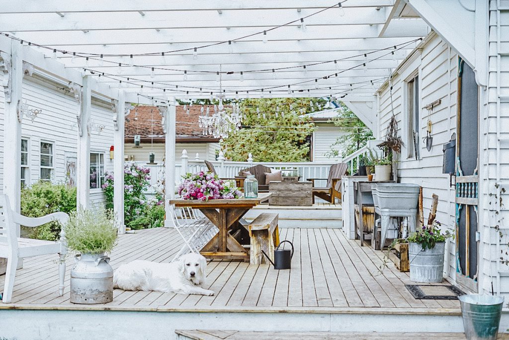 Pergola on a back deck painted in Oxford White by Benjamin Moore