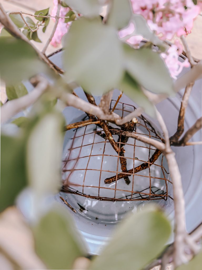a homemade flower frog for holding up lilacs