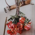 hang drying roses on a hook