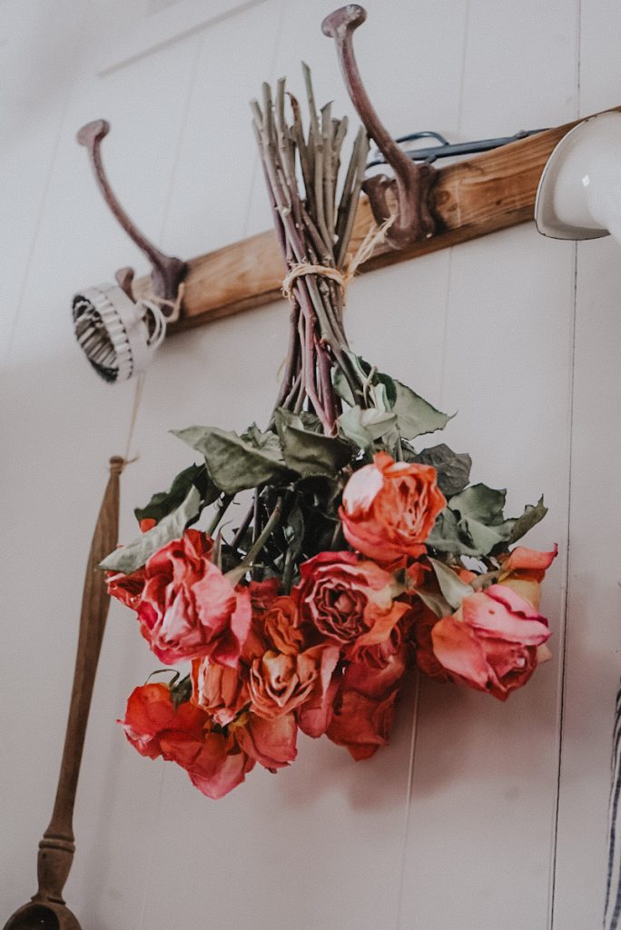 hang drying roses on a hook