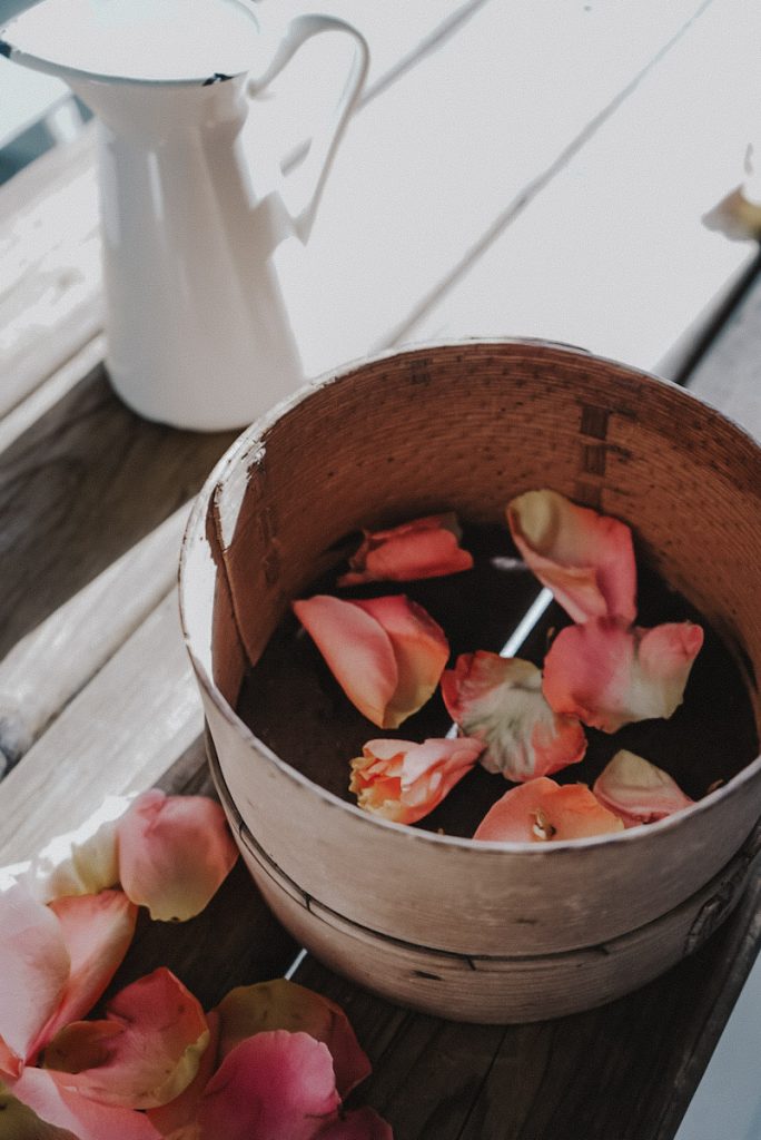 air drying rose petals on a screen. Laying rose petals out to be dried