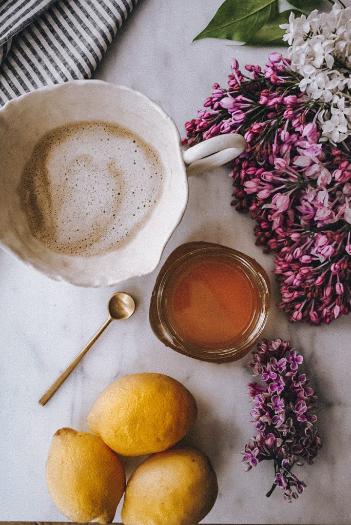 lilac simple syrup added to a latte for a delicious drink