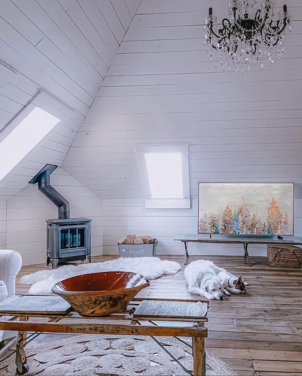 Frame Television with winter art scene on it.
