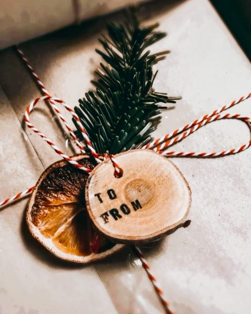 Hand stamped wood slice ornament.
