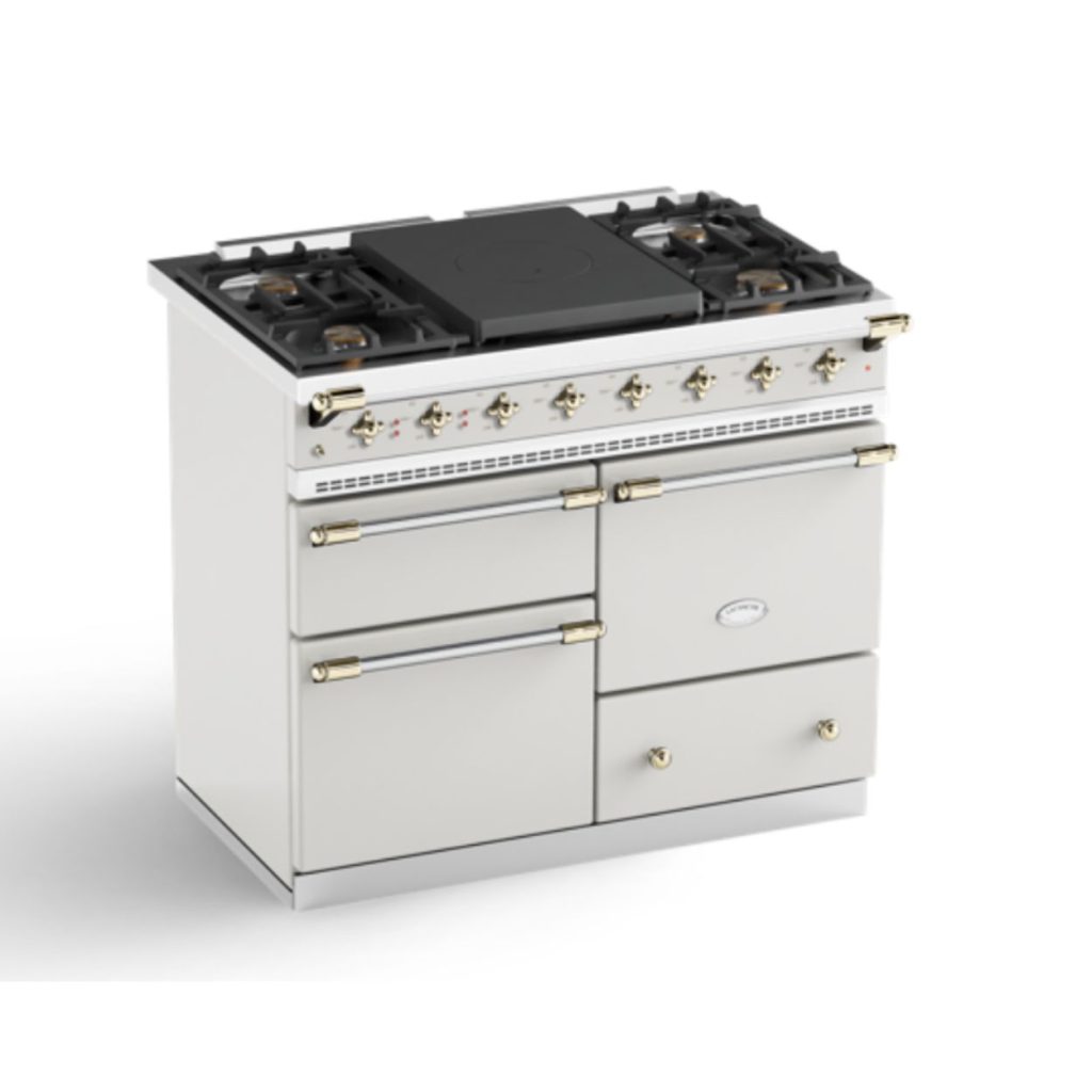 A stunning Lacanche white Chagny stove that has a traditional cast iron french top.