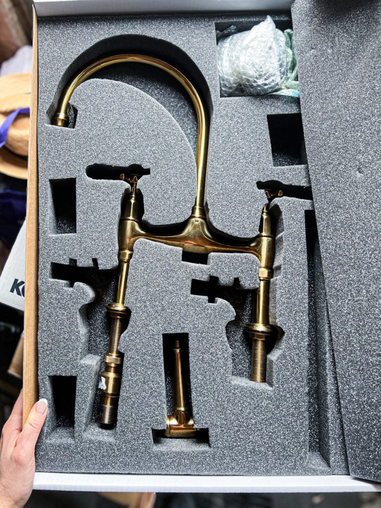 Devol unlaquered brass faucet for a kitchen.