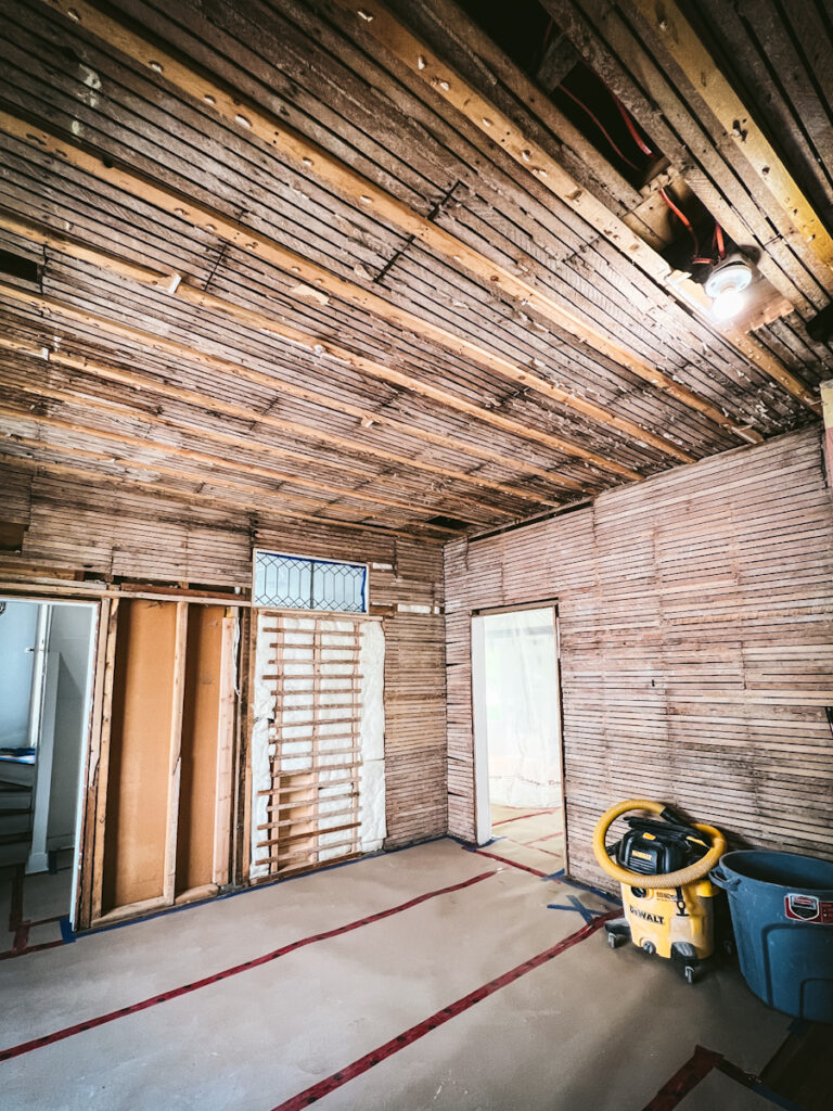Exposed lath and plaster walls during a renovation.