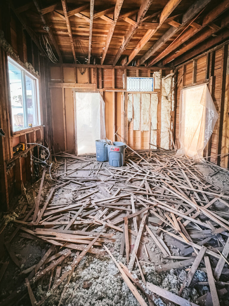 Taking down lath and plaster walls in an old house.