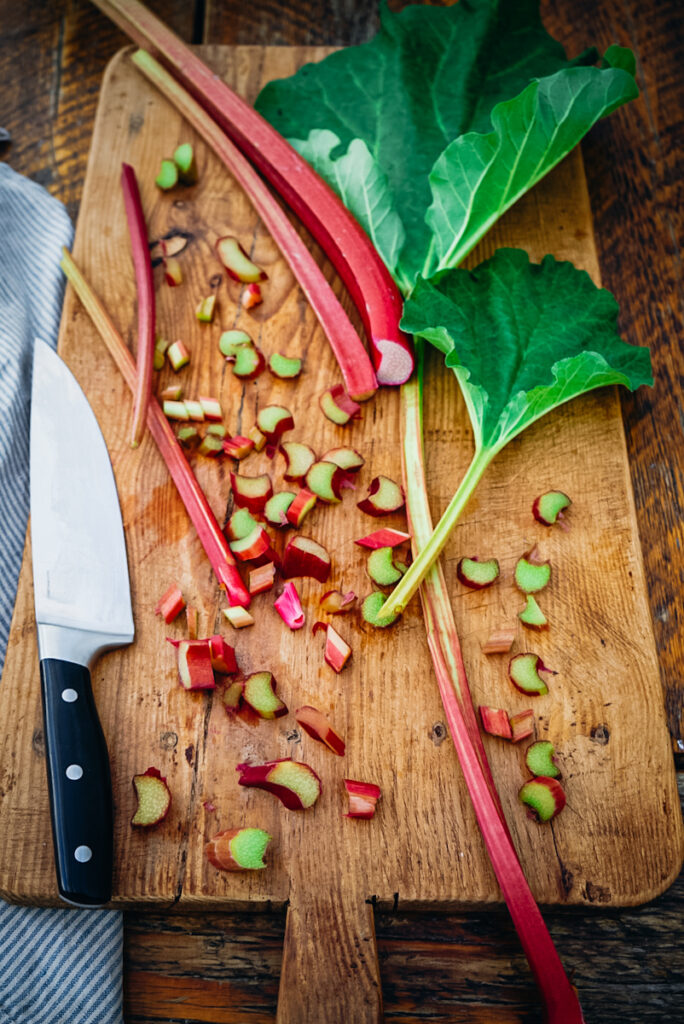 Cutting rhubarb pieces to make a Rhubarb Galette recipe.