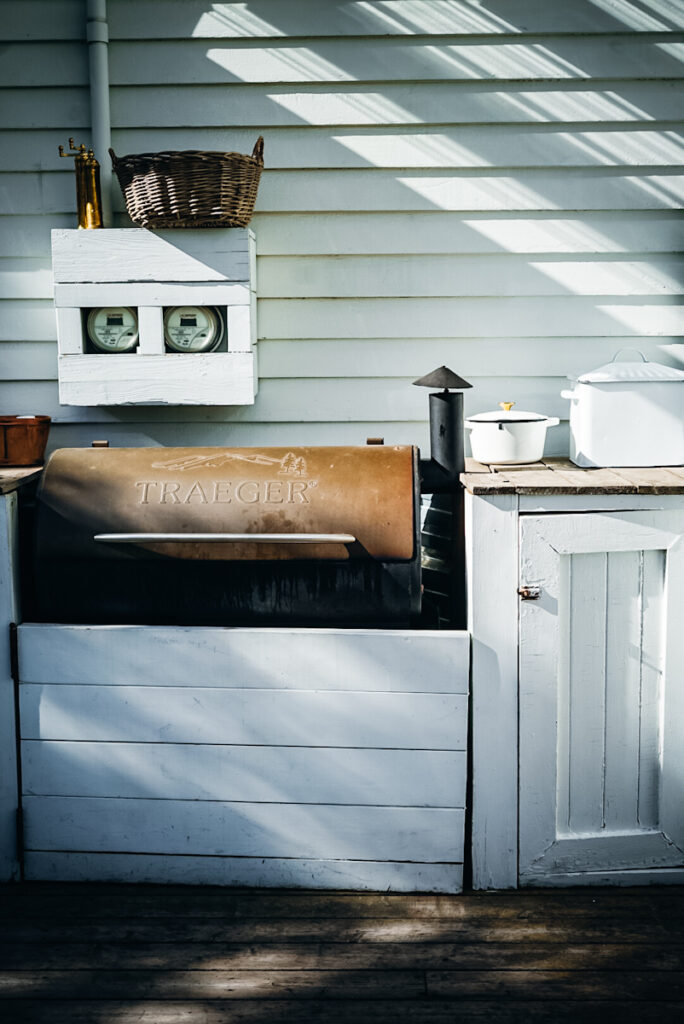 Built in Treager smoker in an outdoor kitchen space.
