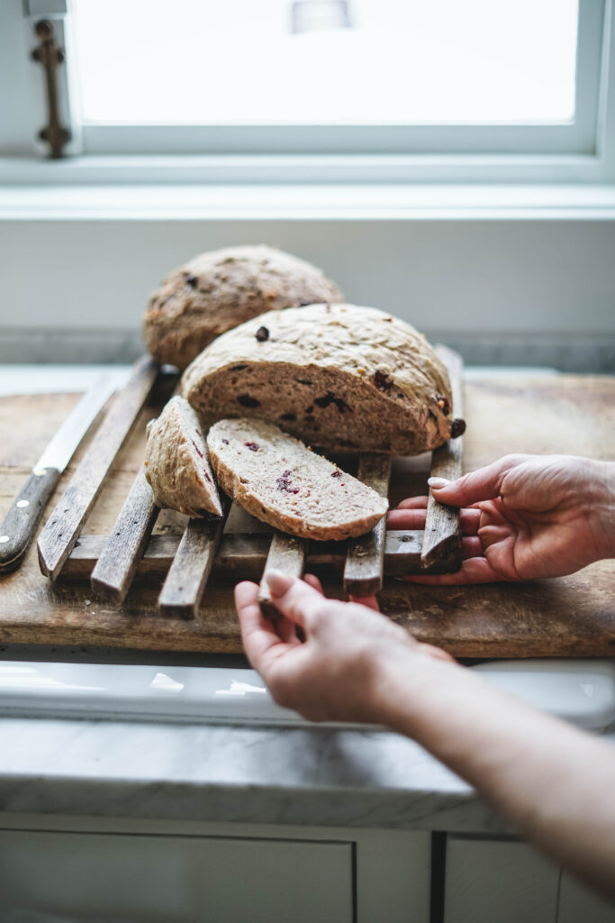 Cranberry Walnut bread sliced and about to be served.