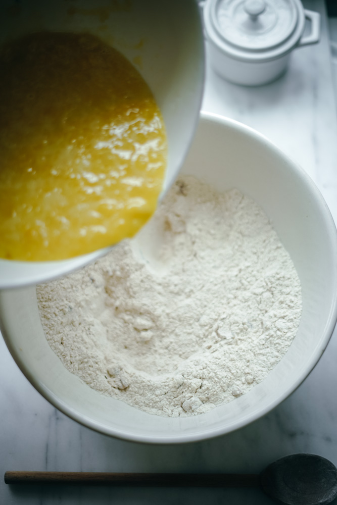 Mixing the wet and dry ingredients to make pineapple bread.