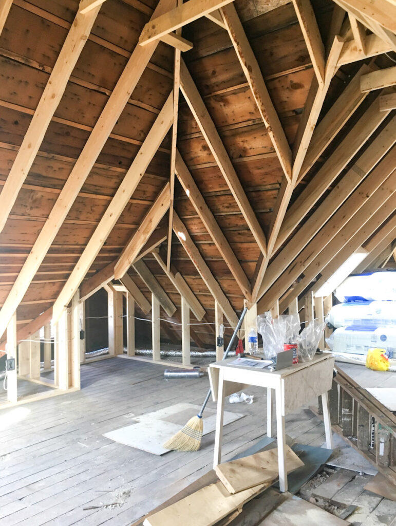 Framing in an attic space to finish it for a living room space. 
