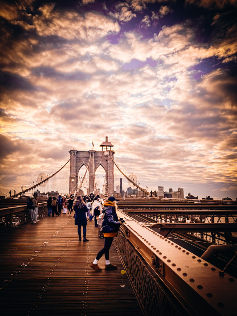 Deborah, B Vintage Style, standing on the Brooklyn bridge.